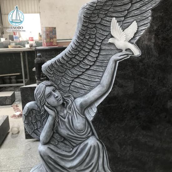 Ange avec colombe sculpté pierre tombale